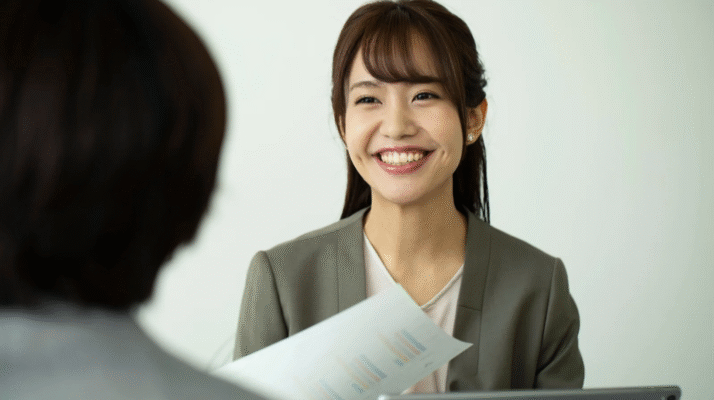 Smiling HR manager in Indonesia interviewing a candidate during a hiring discussion